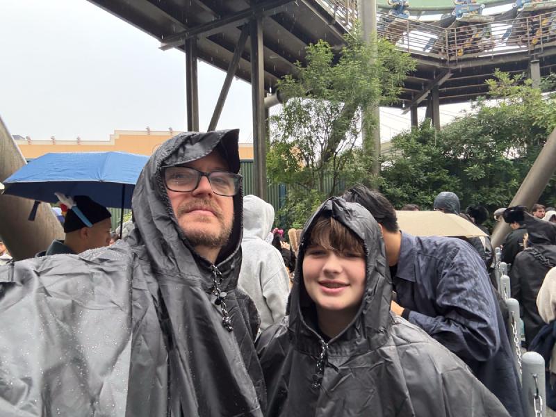 This is the face of a man who carried a poncho for 8 days in case it rained actually wearing a poncho in heavy rain and feeling totally vindicated.